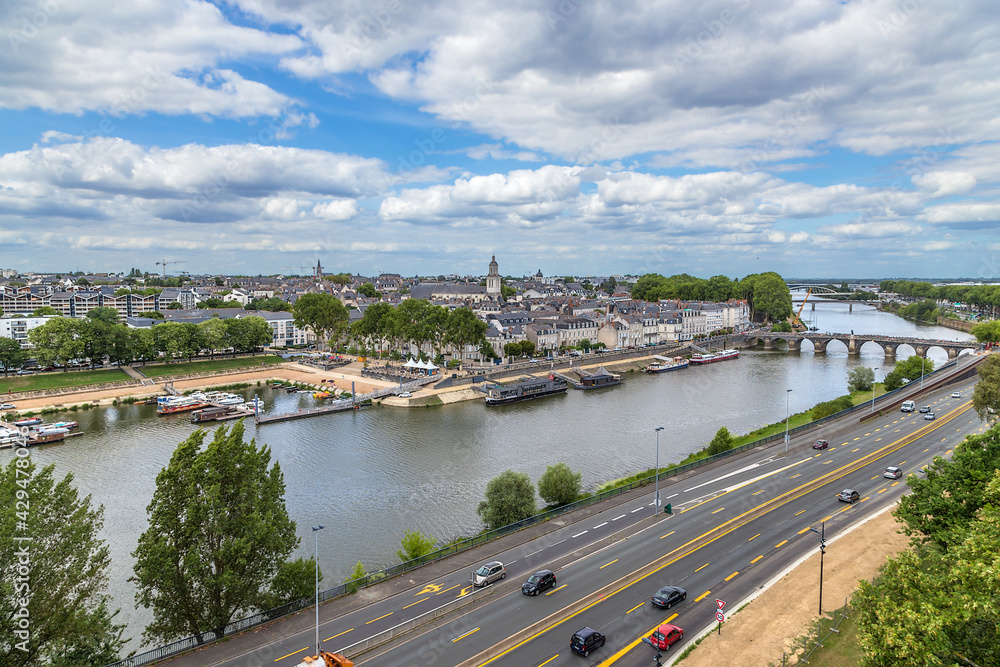 Obraz premium Angers, France. Scenic view of the embankment and the Maine river with bridges 