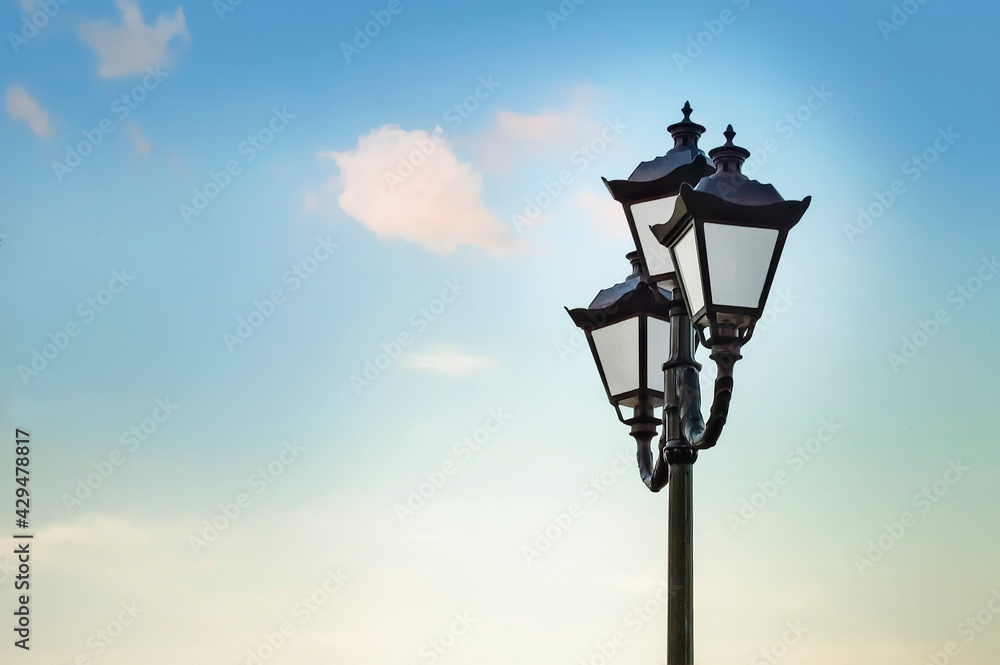 Beautiful vintage lantern against the sky.