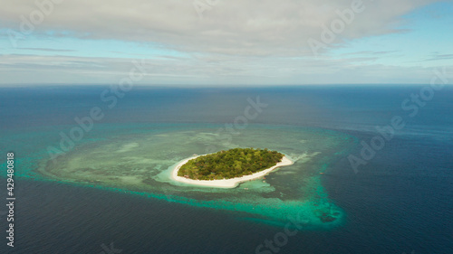 Beautiful beach on tropical island surrounded by coral reef, top view. Mantigue island. Small island with sandy beach. Summer and travel vacation concept, Camiguin, Philippines, Mindanao © Alex Traveler