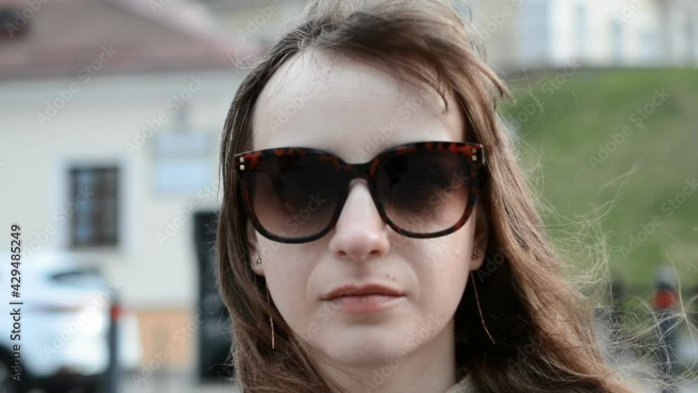 serious or sad girl portrait in sunglasses serious or sad girl portrait in sunglasses