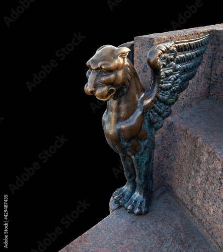 Bronze Griffin on a granite embankment in Saint-Petersburg photo