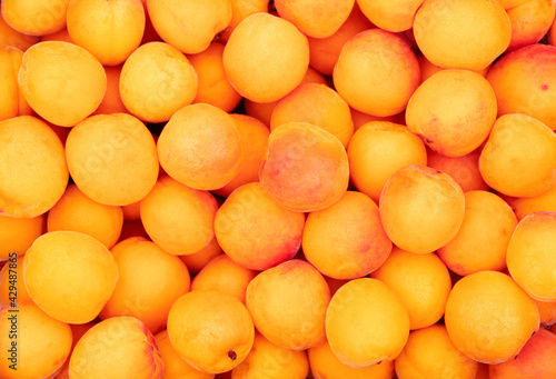 Bright  fresh  organic apricots as fruit background