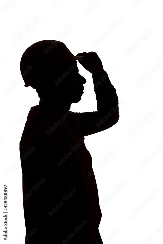 builder contractor silhouette holding on to helmet visor on isolated background, male profession concept