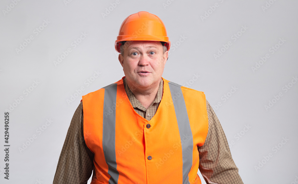 fat construction worker in funny confusion in hard hat and reflective vest, bulder does not understand and showing comic face expression fat construction worker in funny confusion in hard hat and reflective vest, bulder does not understand and showing comic face expression