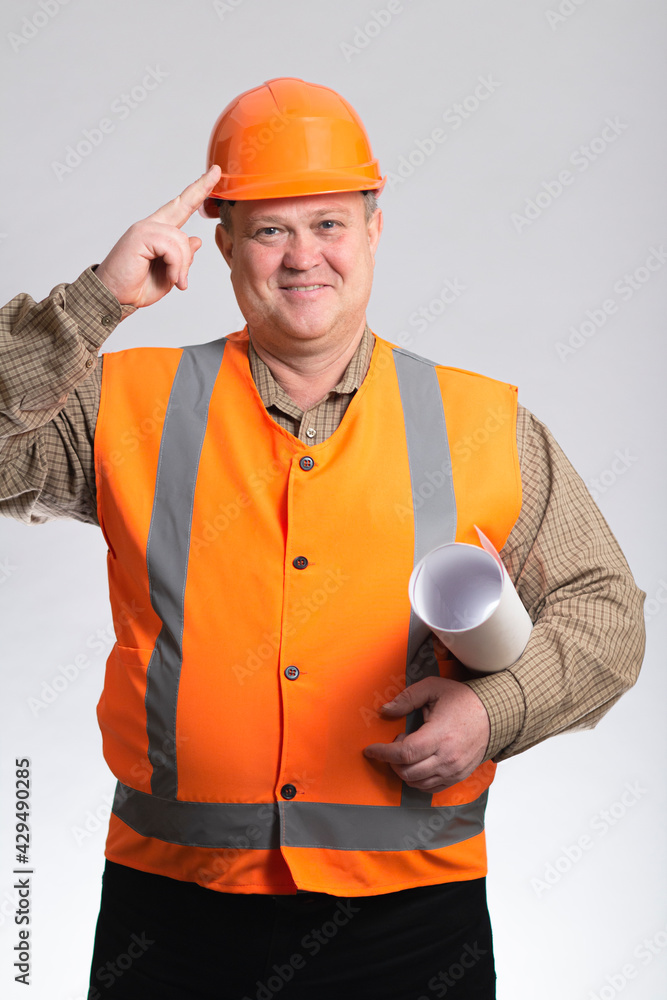 cheerful fat construction worker with belly in hard hat greeting on studio background, happy