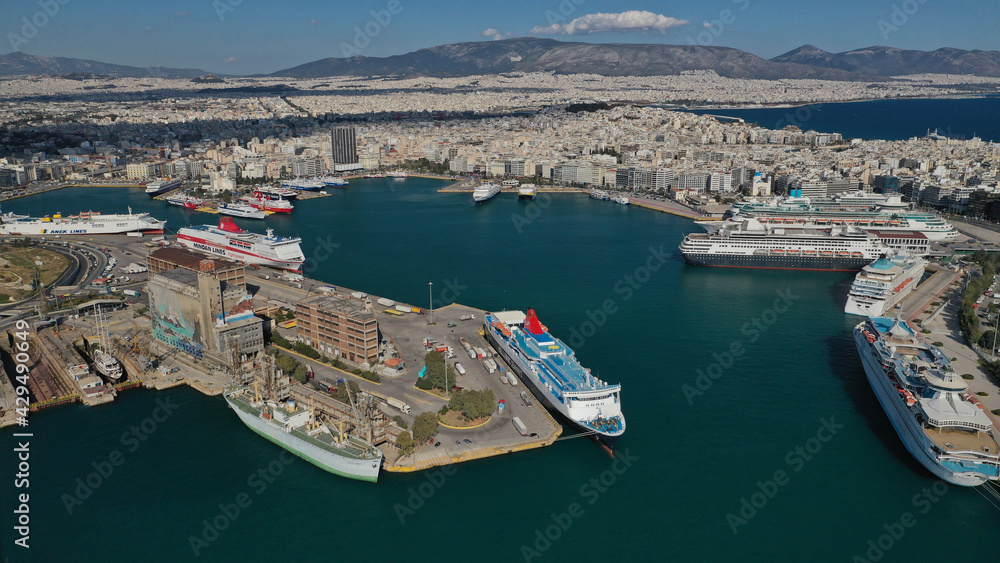 Aerial drone panoramic photo of famous and busy port of Piraeus where passenger ships travel to popular Aegean destinations, Attica, Greece Aerial drone panoramic photo of famous and busy port of Piraeus where passenger ships travel to popular Aegean destinations, Attica, Greece