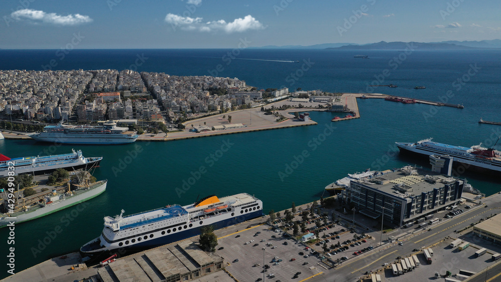 Aerial drone panoramic photo of famous and busy port of Piraeus where passenger ships travel to popular Aegean destinations, Attica, Greece Aerial drone panoramic photo of famous and busy port of Piraeus where passenger ships travel to popular Aegean destinations, Attica, Greece