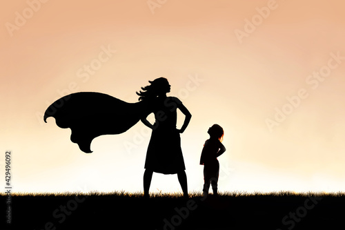 Strong Beautiful Caped Super Hero Woman Silhouette Isolated Agai photo