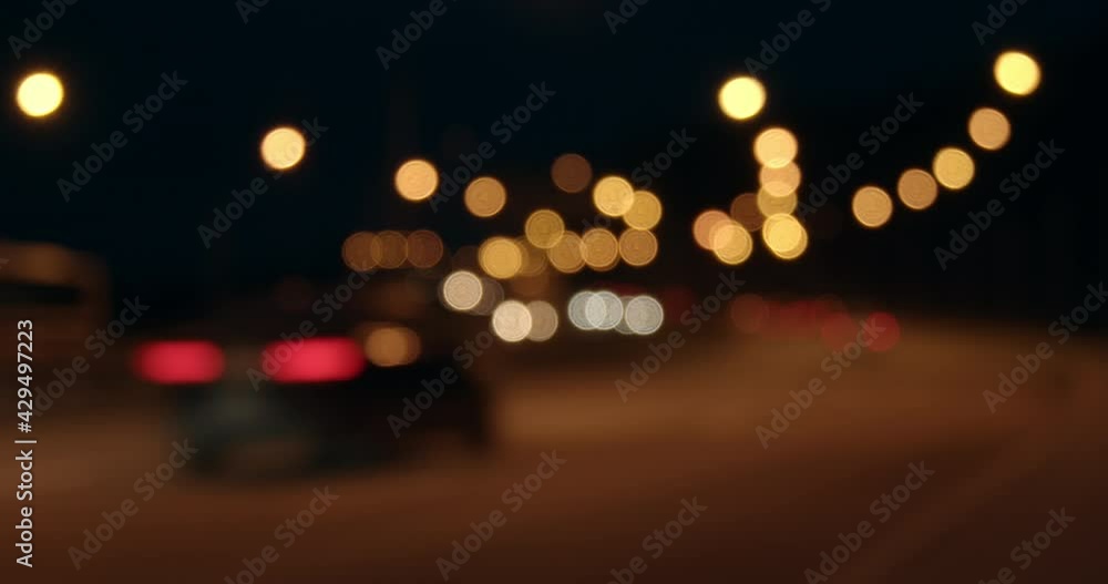 Time lapse of car traffic on the highway. Night traffic of cars is out of focus. Blurred light from lanterns and headlights. Time lapse of car traffic on the highway. Night traffic of cars is out of focus. Blurred light from lanterns and headlights.