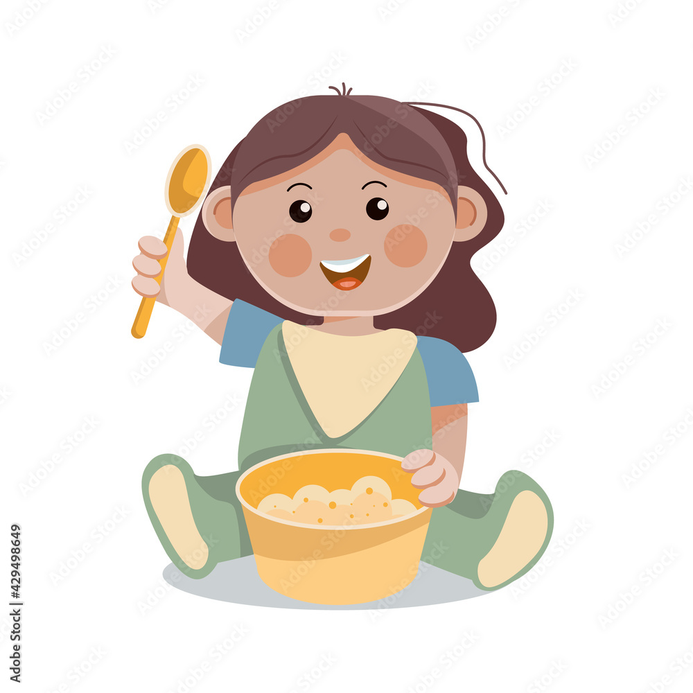 A little girl with a spoon eats porridge.