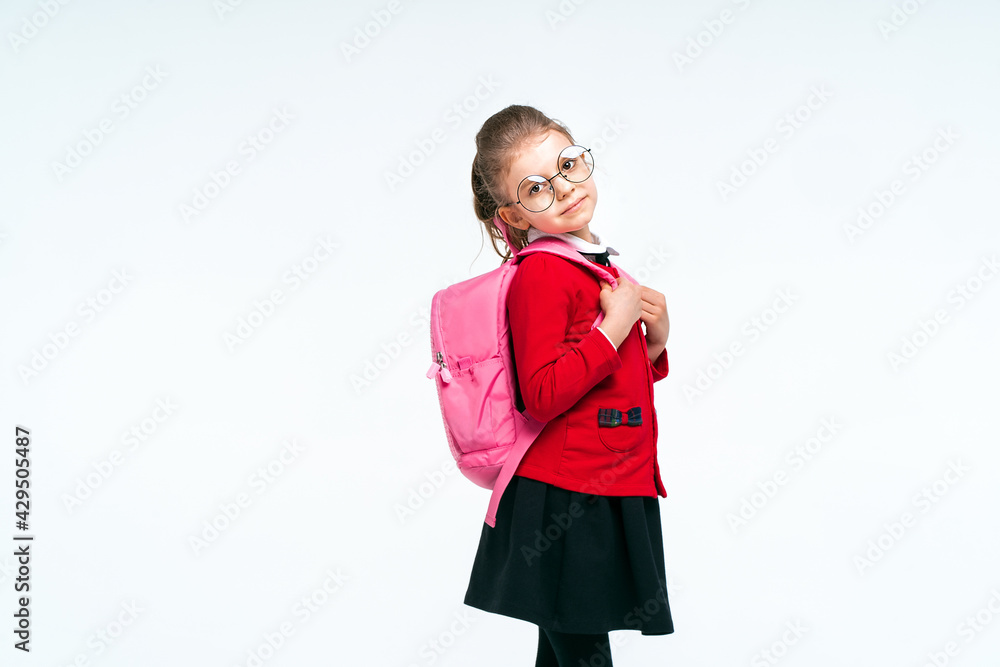 Adorable little girl in red school jacket, black dress, rounded Adorable little girl in red school jacket, black dress, rounded