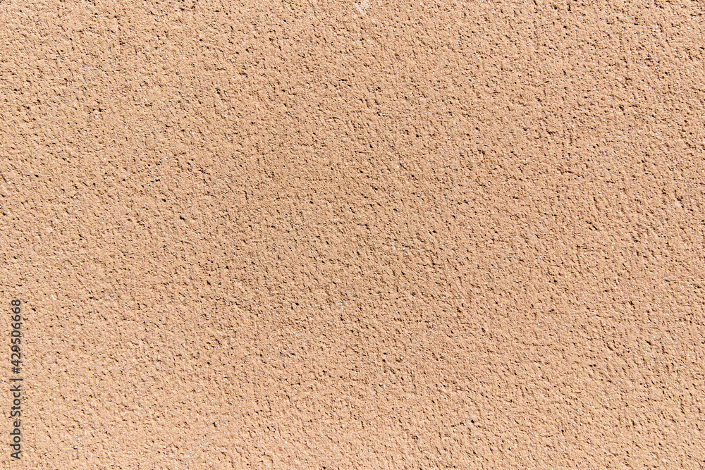 Sunlit wall in salmon tones. Flat surface. Sunlit wall in salmon tones. Flat surface.