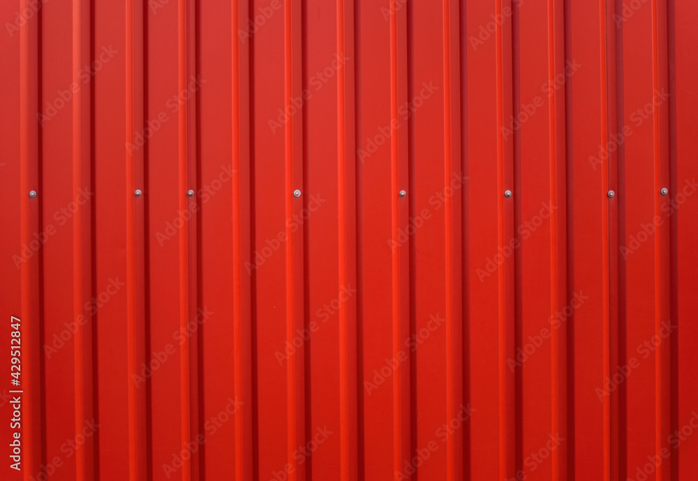 Building wall clad in red plastic siding Building wall clad in red plastic siding