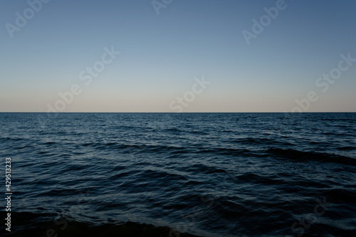 Clear evening sky over the ocean. Theme of travel  romance  vacation  ecology. Modern stylish  copy space.