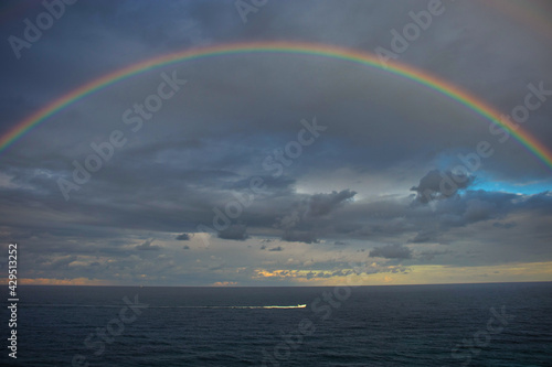 Fototapeta Naklejka Na Ścianę i Meble -  Sailing under a magnificent rainbow