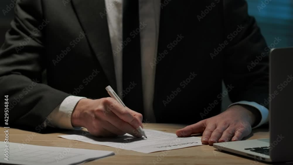 Business man checking and signing by pen a contract. Boss in business suit sits at table in office. Signing on papers, agreement or deal, approval partnership. Close up. Slow motion ready, 4K at 59 Business man checking and signing by pen a contract. Boss in business suit sits at table in office. Signing on papers, agreement or deal, approval partnership. Close up. Slow motion ready, 4K at 59