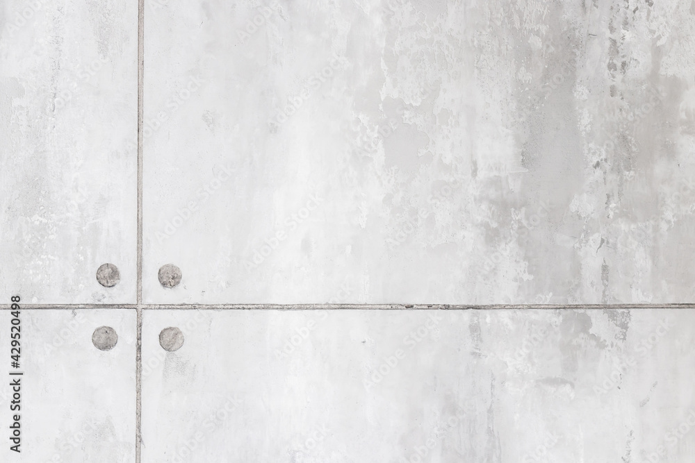 Gray concrete wall painted in white and gray, loft style. Gray concrete wall painted in white and gray, loft style.
