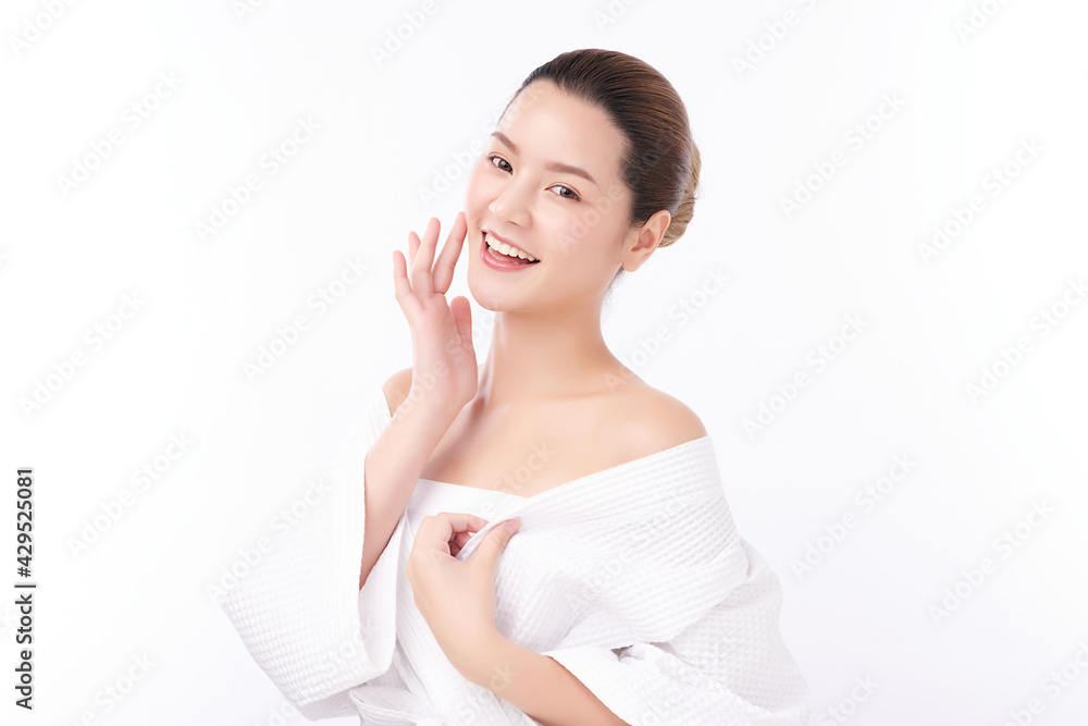 Beautiful young Asian woman wearing bathrobe on white background, Face care, Facial treatment, Cosmetology, beauty and spa Concept. Beautiful young Asian woman wearing bathrobe on white background, Face care, Facial treatment, Cosmetology, beauty and spa Concept.