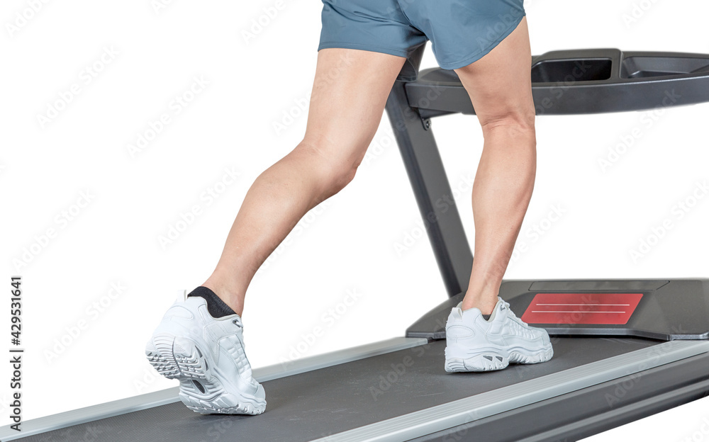 Man's legs working out on Exercise Equipment Man's legs working out on Exercise Equipment