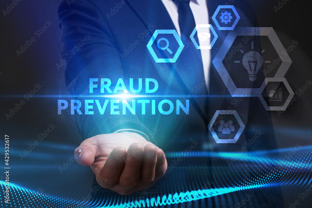 Business, Technology, Internet and network concept. Young businessman working on a virtual screen of the future and sees the inscription: Fraud prevention Business, Technology, Internet and network concept. Young businessman working on a virtual screen of the future and sees the inscription: Fraud prevention
