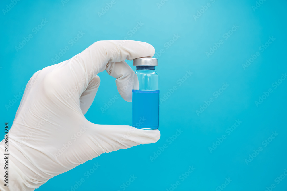 Syringe and vaccine via. Medicine vials and syringe. Treatment for