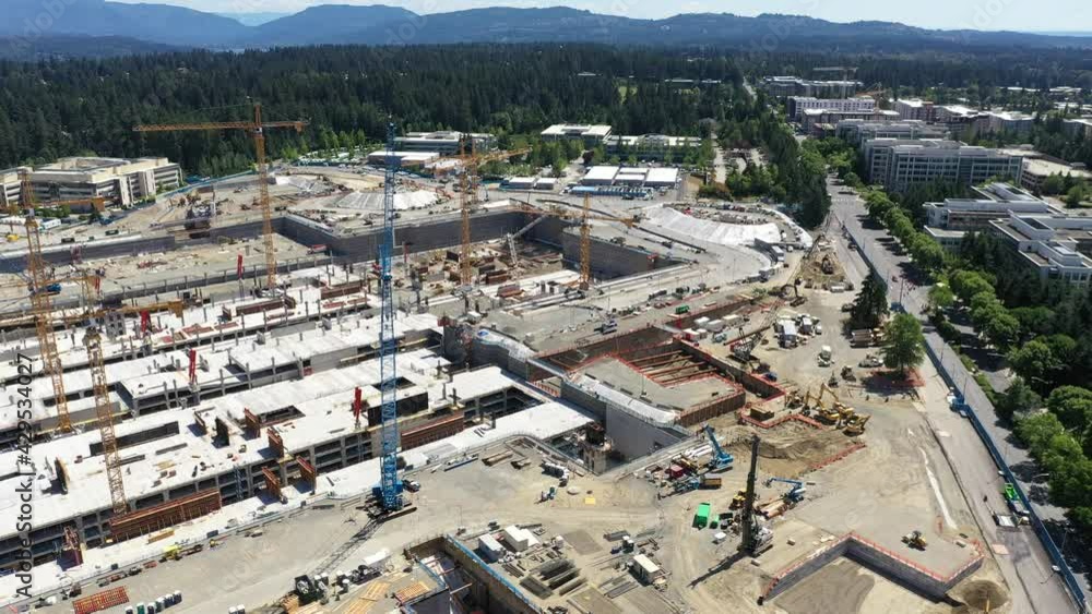 Cinematic bird's-eye drone view, development of the new campus at the Microsoft Corporate Headquarters, Microsoft Commons, Microsoft Studio in Overlake and Redmond, Washington, near Bellevue, Seattle Cinematic bird's-eye drone view, development of the new campus at the Microsoft Corporate Headquarters, Microsoft Commons, Microsoft Studio in Overlake and Redmond, Washington, near Bellevue, Seattle