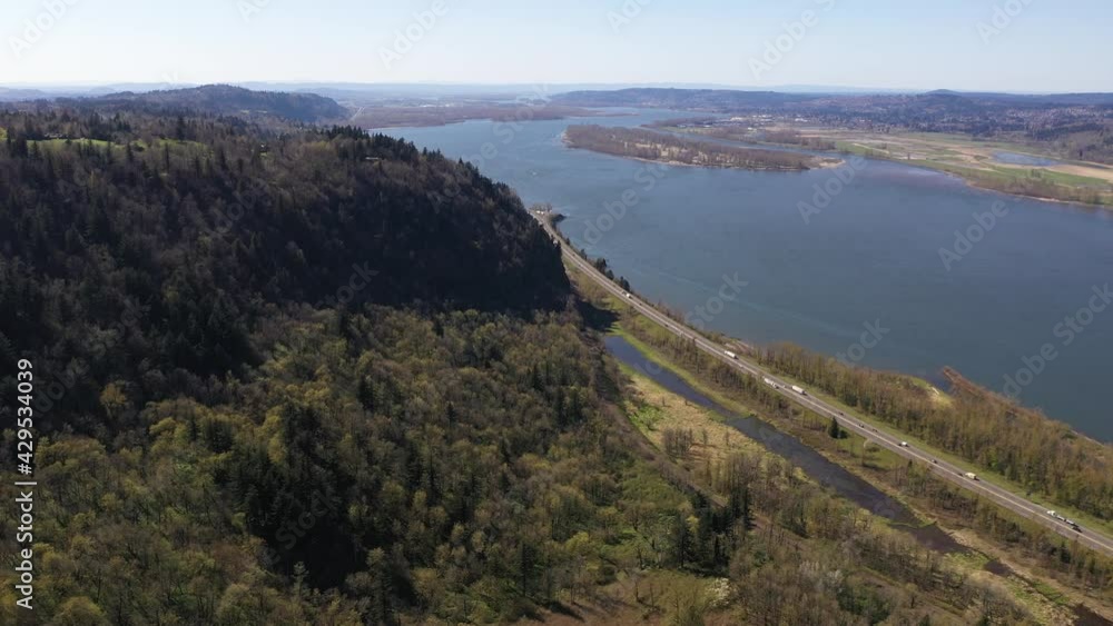 Cinematic aerial drone shot of the popular Scenic Viewpoint near the Vista House, a scenic overlook with a tower near majestic waterfalls at the Columbia River Gorge near Portland Oregon Cinematic aerial drone shot of the popular Scenic Viewpoint near the Vista House, a scenic overlook with a tower near majestic waterfalls at the Columbia River Gorge near Portland Oregon