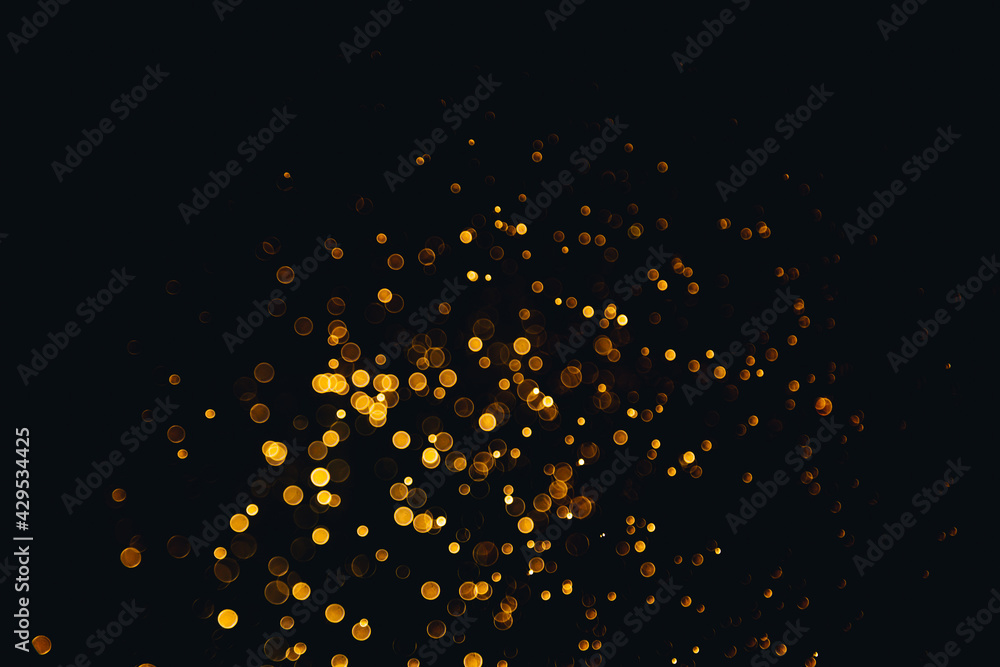 Abstract gold bokeh with black background Abstract gold bokeh with black background