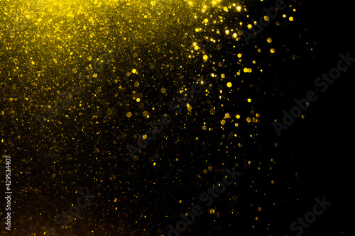 Glittering stars of blur gold bokeh
