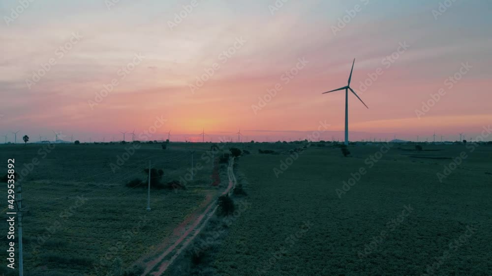 Aerial view of Wind turbines Energy Production- 4k aerial shot on sunset. Aerial view of Wind turbines Energy Production- 4k aerial shot on sunset.