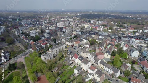 Bochum Wattenscheid skyline on a sunny day, aerial drone pull back shot photo