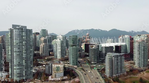 Aerial Drone Shot of Downtown Vancouver Skyline in the afternoon with traffic on the bridge photo