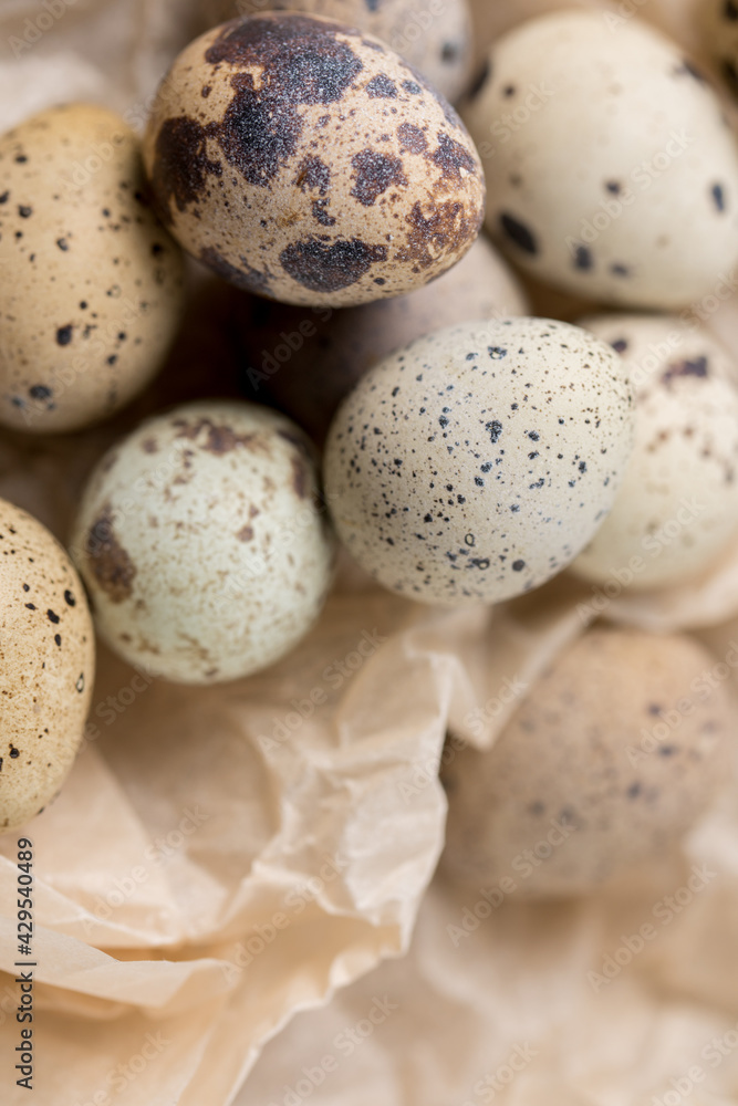 Still life. Quail eggs on a textured background. Rustic. Easter celebration concept.