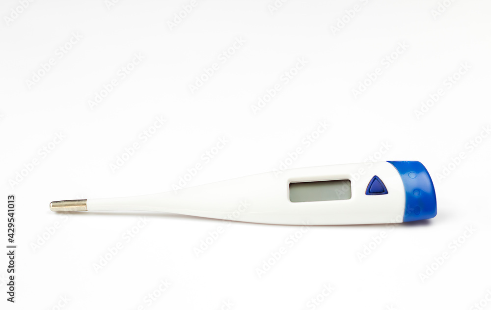 white thermometer with a blue stripe lies on a white background white thermometer with a blue stripe lies on a white background