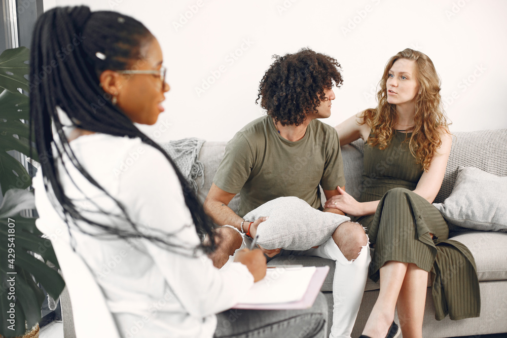 Couple having conversation with psychologist on therapy Couple having conversation with psychologist on therapy