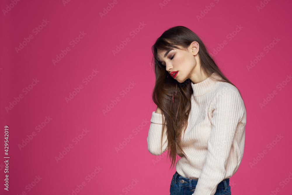 Beautiful brunette long hair fashionable clothes elegant style pink background Beautiful brunette long hair fashionable clothes elegant style pink background