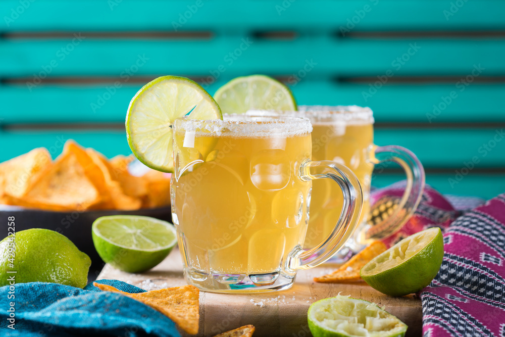 Fototapeta premium Mexican alcohol cocktail chelada with light beer and lime juice