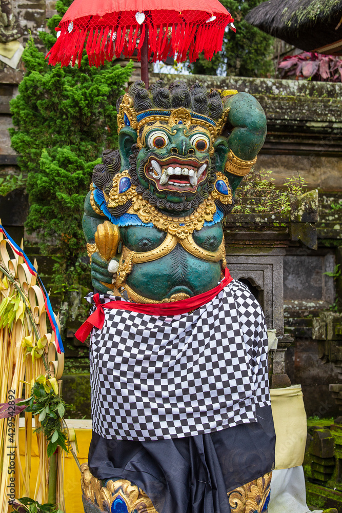 Traditional Balinese demon statue in the street temple. Island Bali, Indonesia