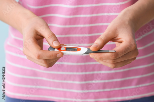 Woman with electronic therm...