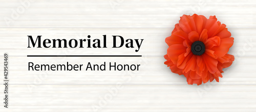 Memorial Day - Remember and Honor Poster. Large Red Poppy Flower on the background of light planks and congratulatory text