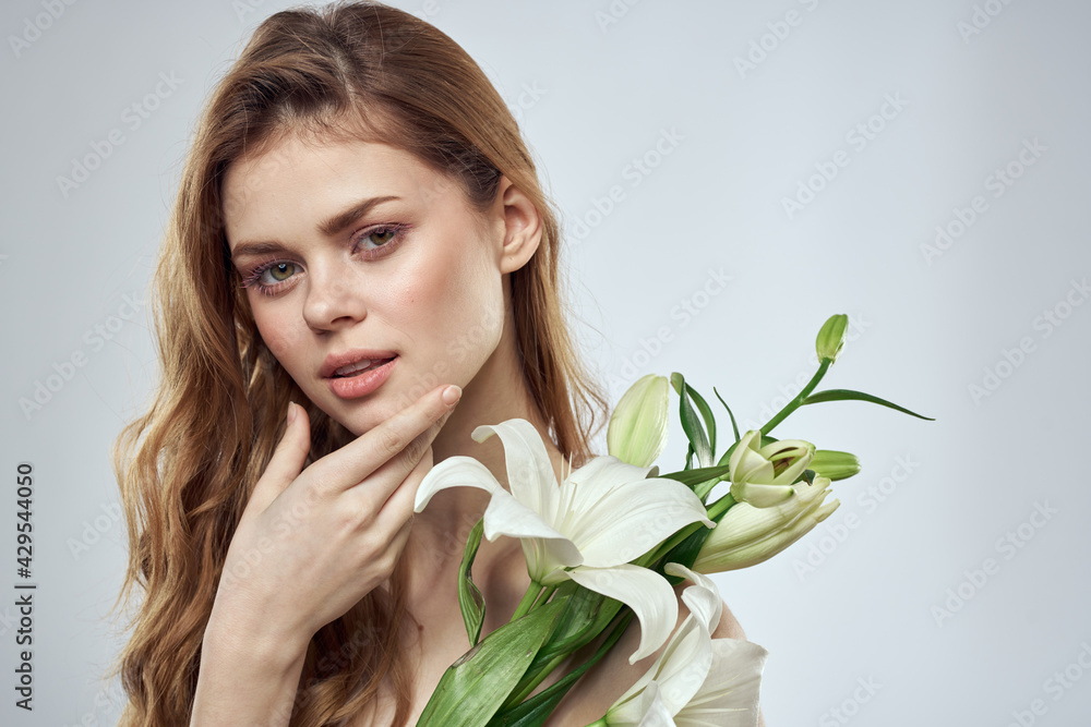 girl with flowers cropped view portrait close-up spring bare shoulders clear skin Make Up