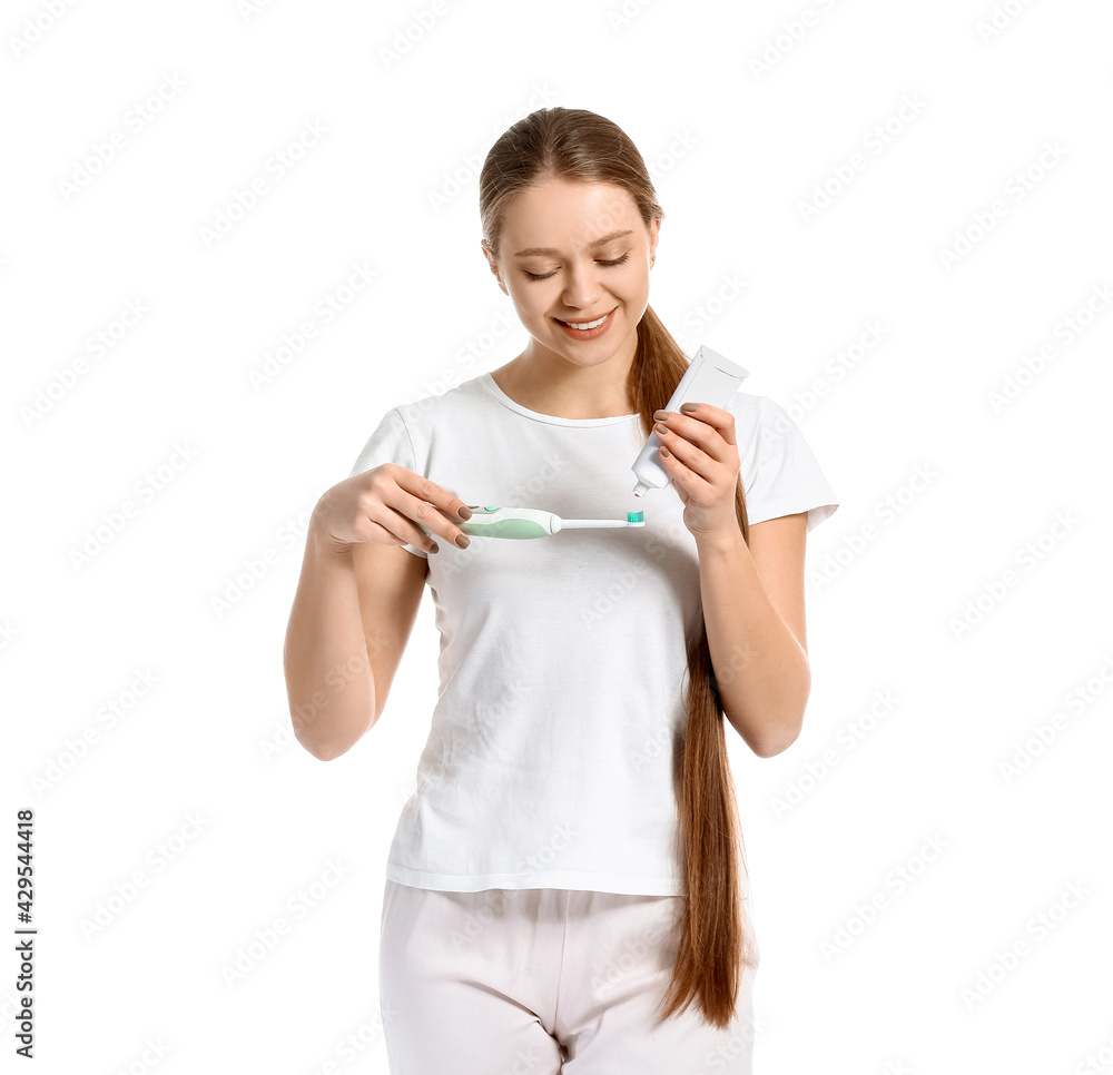 Young woman brushing teeth on white background Young woman brushing teeth on white background