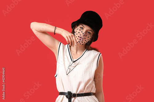 Fashionable young woman wea...