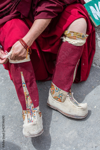 Footwear worn by a buddhist monk during a festival in tibetan monastery near mountain village Leh in ladakh region, north India