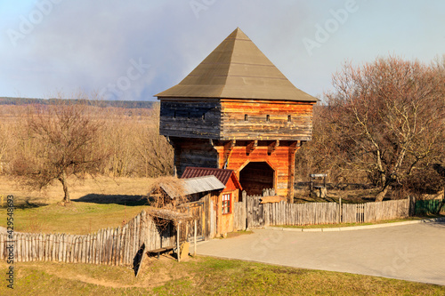 Old wooden watchtower in Subotiv village, Ukraine photo