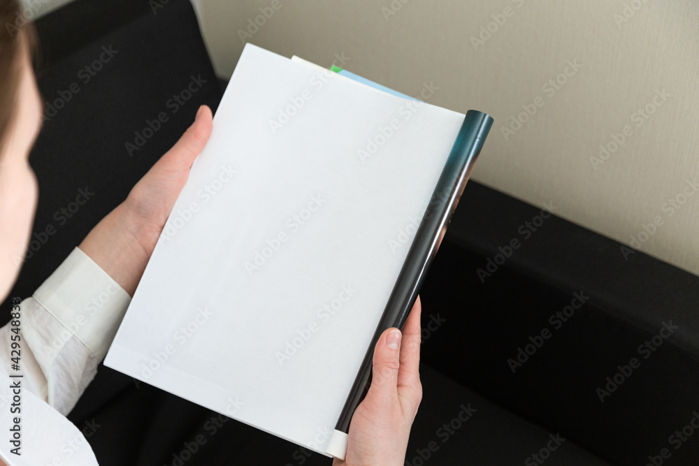 Hand holds white magazine with blank cover mock up. Hand in shirt hold clear magazine mockup template. A4 book softcover surface design. Hand holds white magazine with blank cover mock up. Hand in shirt hold clear magazine mockup template. A4 book softcover surface design.