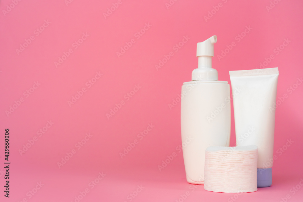 Stack of cotton discs and skicare cosmetic bottle Stack of cotton discs and skicare cosmetic bottle