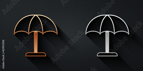 Gold and silver Sun protective umbrella for beach icon isolated on black background. Large parasol for outdoor space. Beach umbrella. Long shadow style. Vector