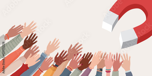 Recruitment.People recruiting concept.Magnet that attracts arms and raised hands of diverse and multicultural people. Occupation.Successful communication and partnership.Banner copy space