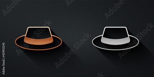 Gold and silver Man hat with ribbon icon isolated on black background. Long shadow style. Vector